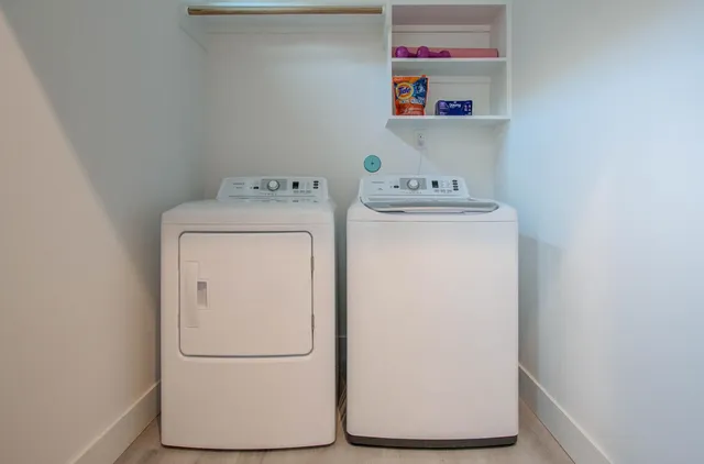 a utility room with dryer and washer