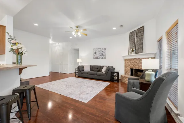 a living room with furniture fireplace and a table