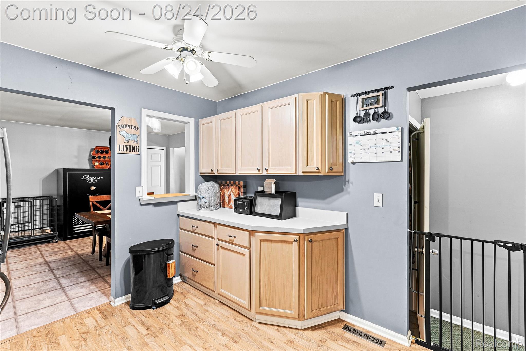 2310 Peppermill Road Lapeer, MI 48446 - Photo 19 of 35 Wood-finish flooring with light-toned cabinetry and light countertops