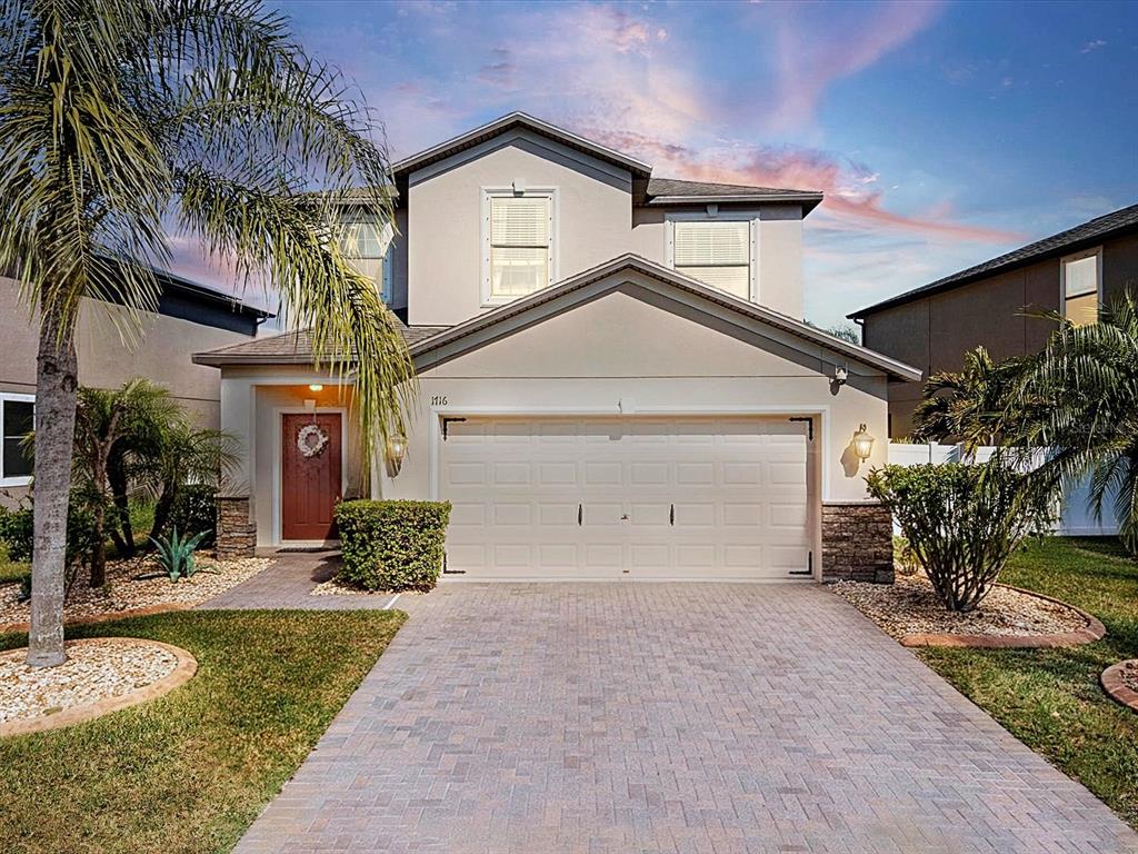 1716 Hadden Hall Place Trinity, FL 34655 - Photo 1 of 75 a front view of a house with a yard