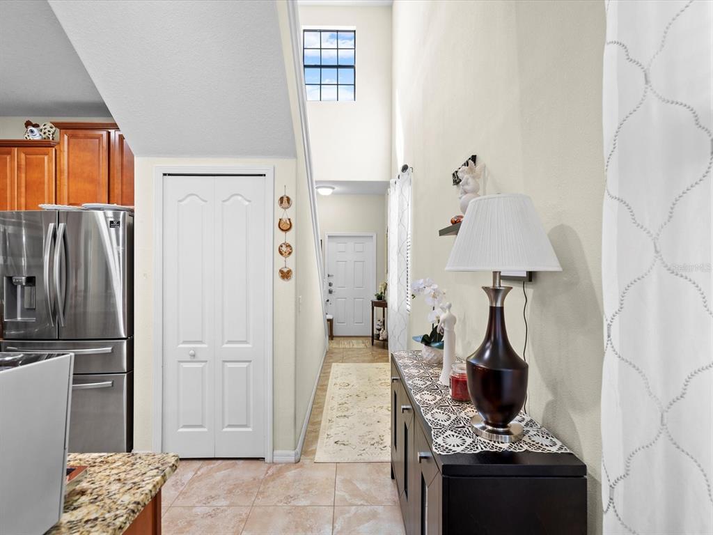 1716 Hadden Hall Place Trinity, FL 34655 - Photo 11 of 75 a kitchen with stainless steel appliances granite countertop a refrigerator and a stove