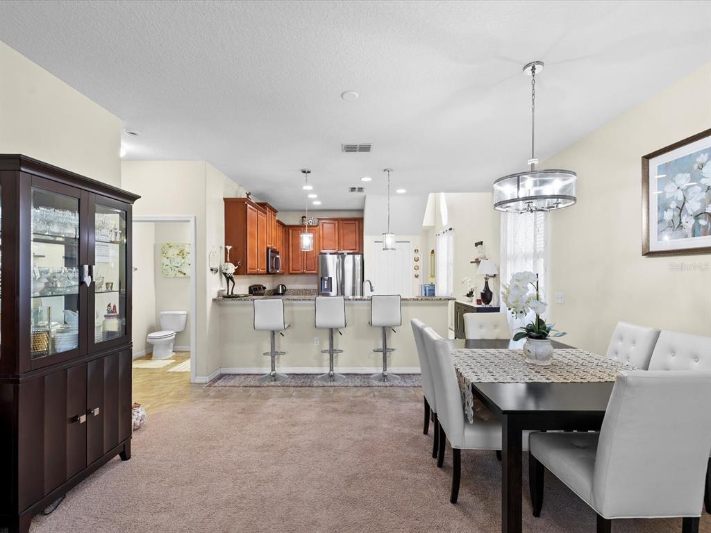 1716 Hadden Hall Place Trinity, FL 34655 - Photo 13 of 75 a dining room with furniture and window