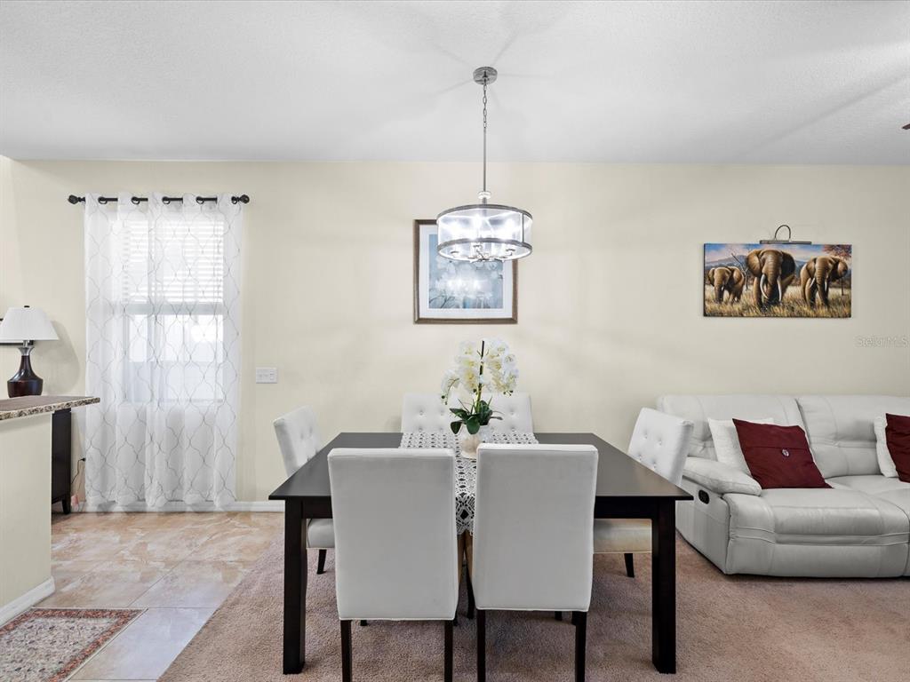 1716 Hadden Hall Place Trinity, FL 34655 - Photo 14 of 75 a view of a dining room with furniture window and outside view