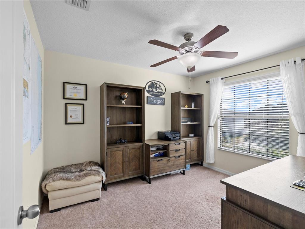 1716 Hadden Hall Place Trinity, FL 34655 - Photo 32 of 75 a living room with furniture and window