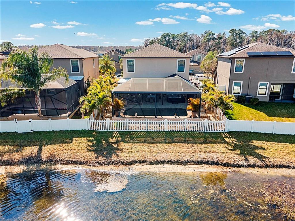 1716 Hadden Hall Place Trinity, FL 34655 - Photo 48 of 75 a view of a house with swimming pool and a yard