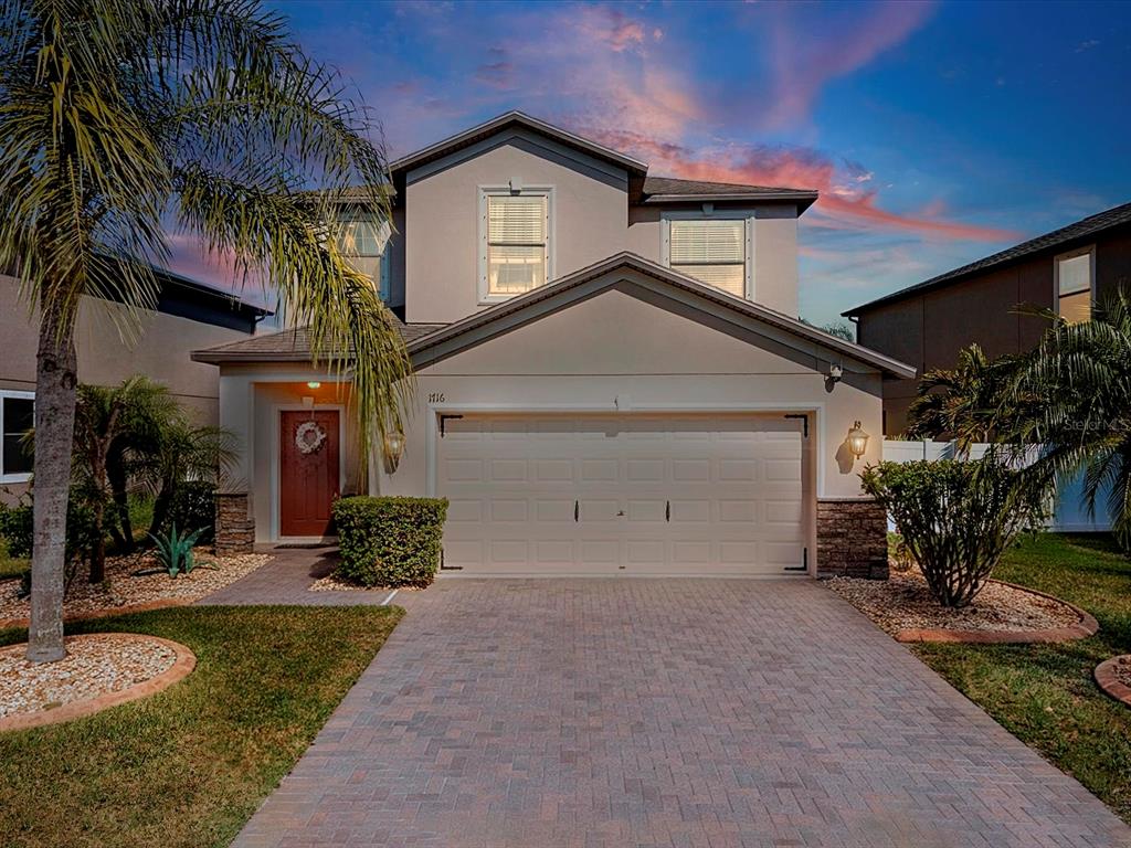 1716 Hadden Hall Place Trinity, FL 34655 - Photo 57 of 75 a front view of a house with a yard