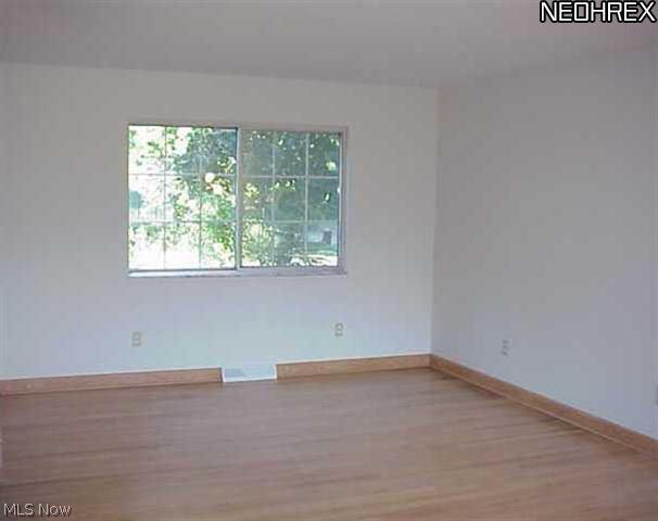 9037 Root Road North Ridgeville, OH 44039 - Photo 2 of 18 View of back of spacious living room.