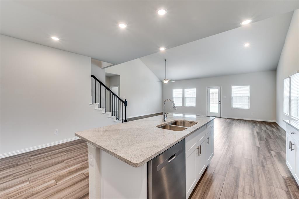 3308 Kingsdown Drive Denton, TX 76207 - Photo 11 of 25 a kitchen with a stove and a sink