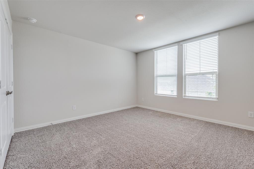 3308 Kingsdown Drive Denton, TX 76207 - Photo 21 of 25 an empty room with windows