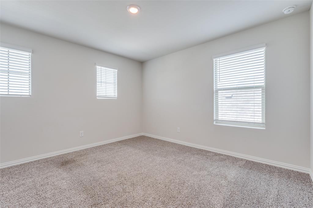 3308 Kingsdown Drive Denton, TX 76207 - Photo 23 of 25 an empty room with a window