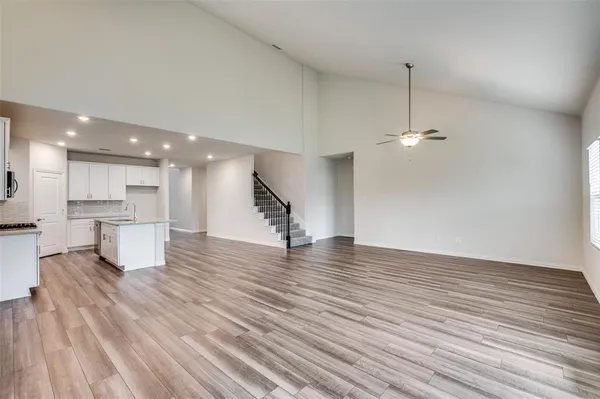 a view of kitchen and kitchen with sink wooden floor