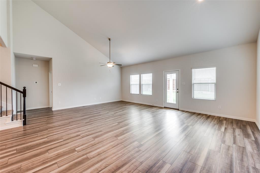 3308 Kingsdown Drive Denton, TX 76207 - Photo 6 of 25 an empty room with wooden floor and windows