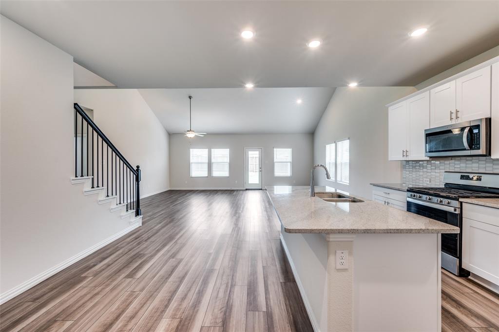 3308 Kingsdown Drive Denton, TX 76207 - Photo 10 of 25 a view of kitchen with sink microwave and stove