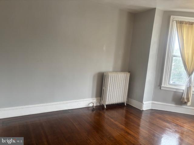 5630 Walnut Street, Unit 2 Philadelphia, PA 19139 - Photo 11 of 28 an empty room with wooden floor and windows