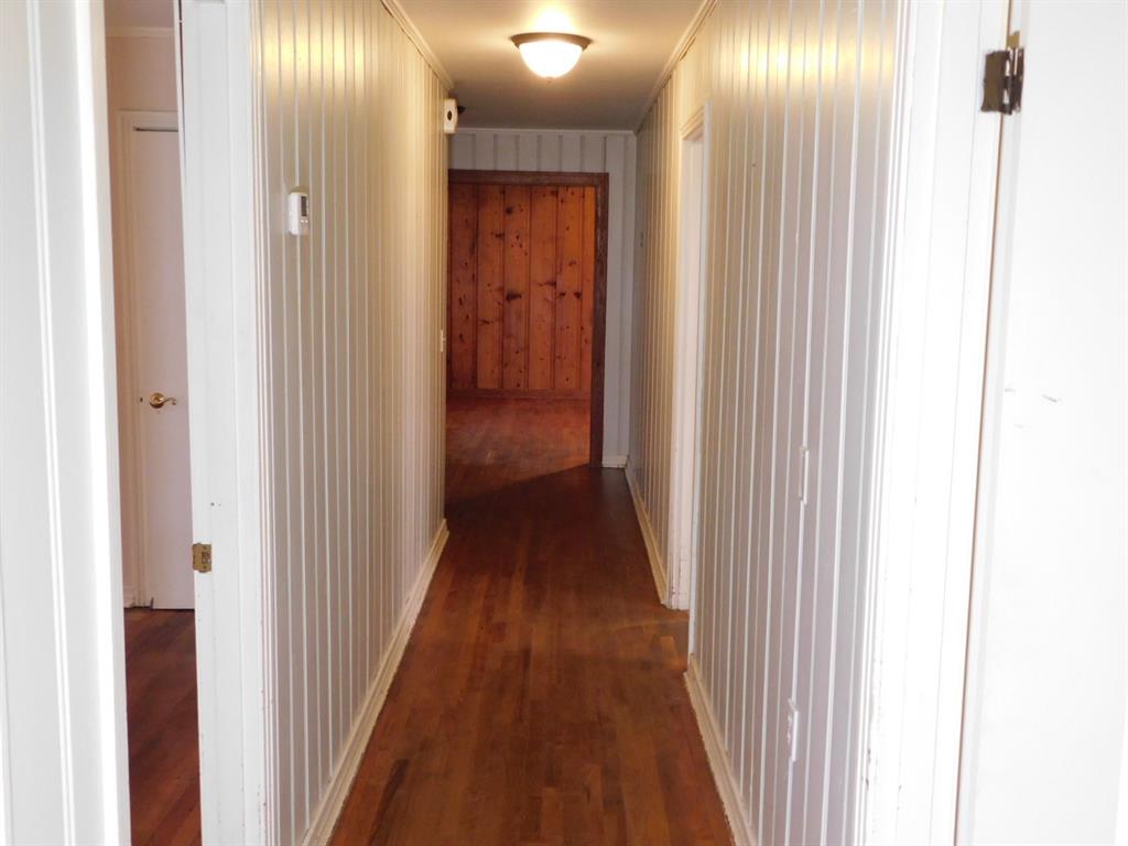 24044 Highway 157 Springhill, LA 71075 - Photo 38 of 40 a view of a hallway with wooden floor