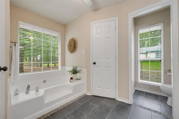 a bathroom with a bathtub and a shower