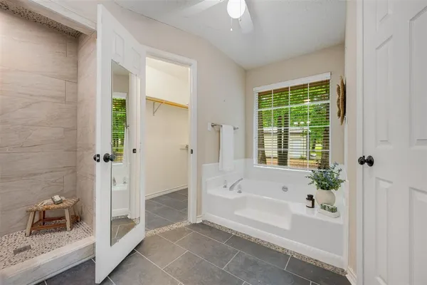 a bathroom with a bathtub and a sink