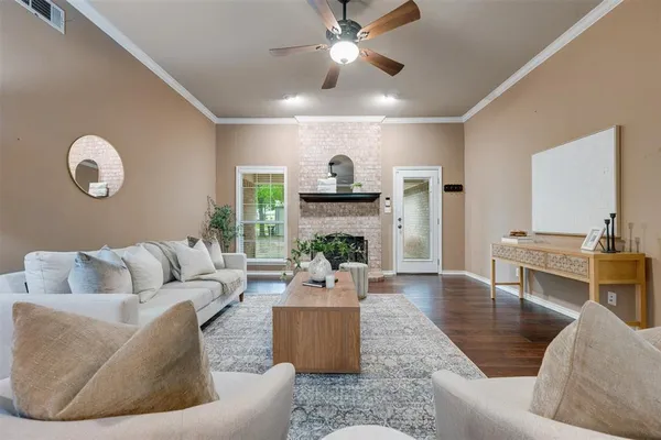 a very nice looking living room with furniture and a wooden floor