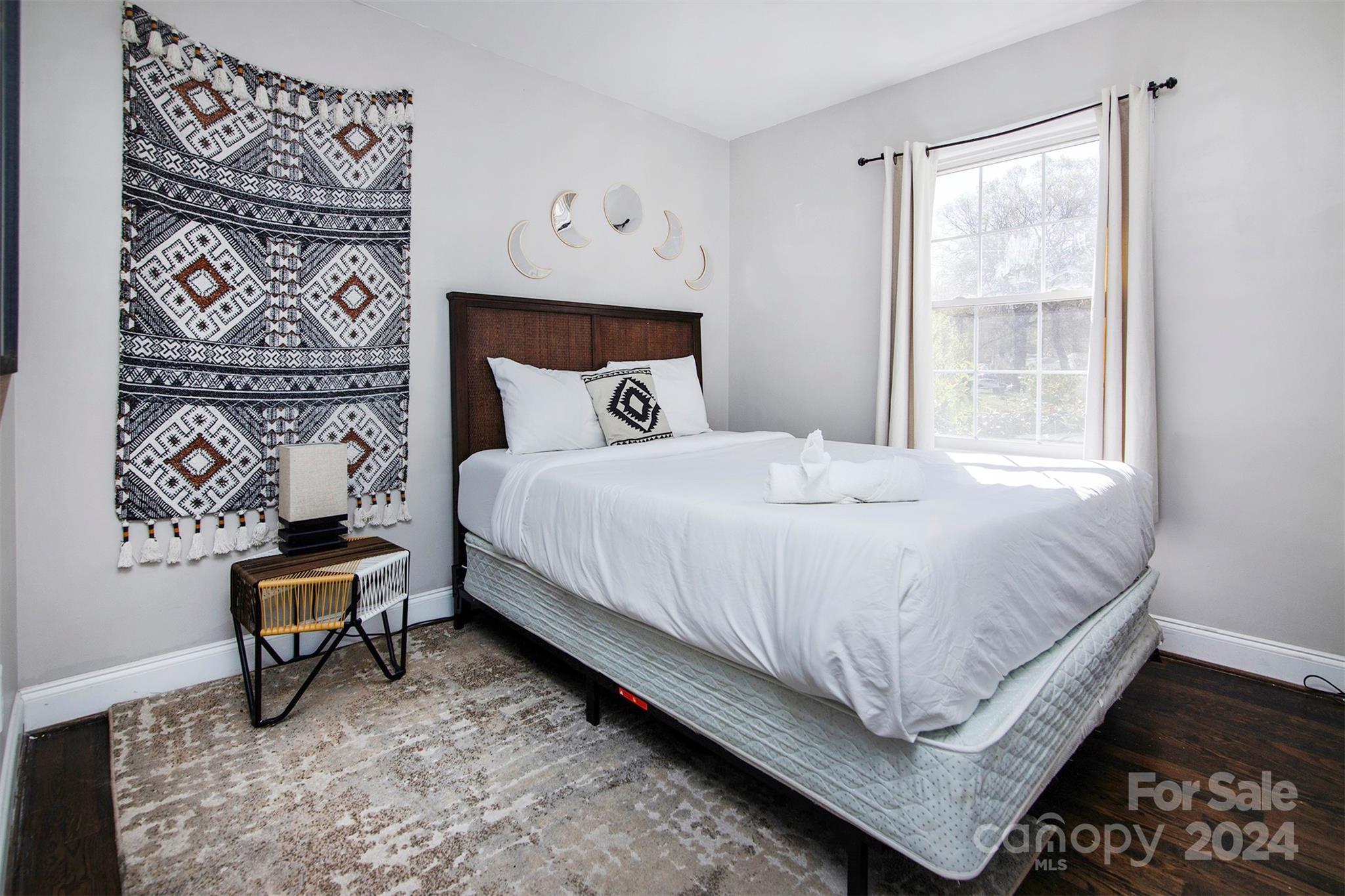 3741 Woodleaf Road Charlotte, NC 28205 - Photo 17 of 31 a bedroom with a bed and chair