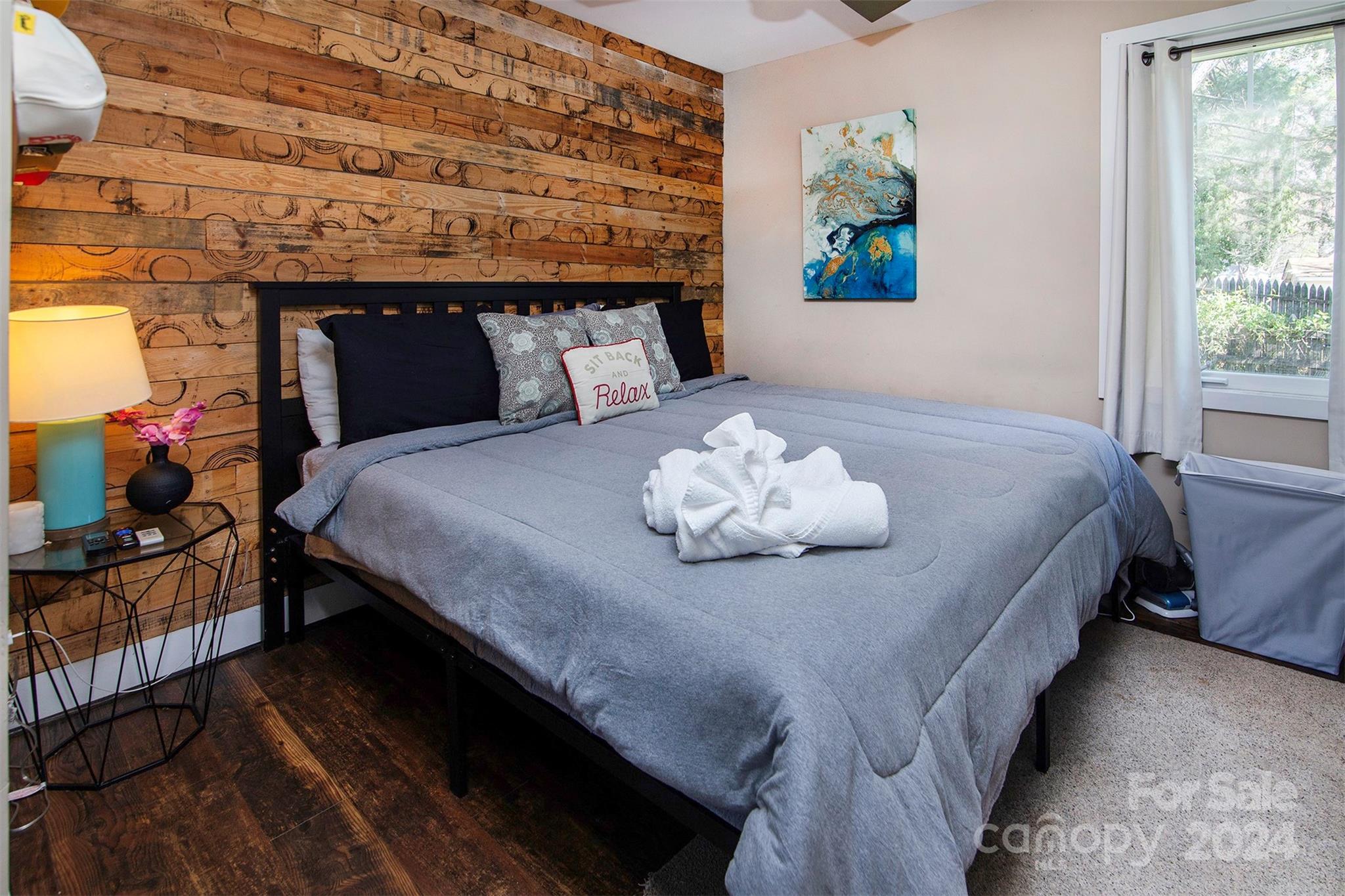 3741 Woodleaf Road Charlotte, NC 28205 - Photo 23 of 31 a bedroom with a bed and wooden floor