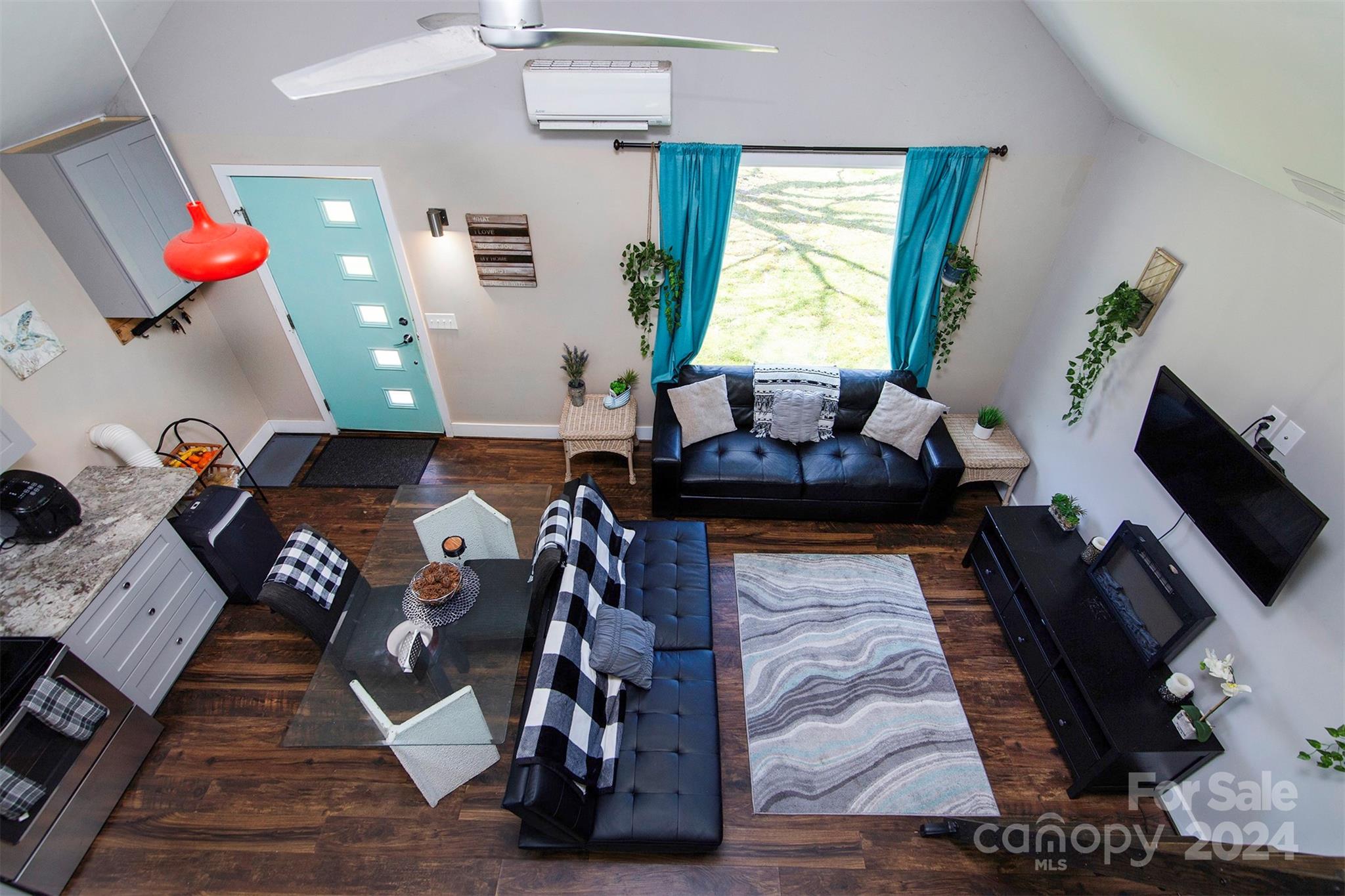 3741 Woodleaf Road Charlotte, NC 28205 - Photo 27 of 31 a living room with furniture and flat screen tv