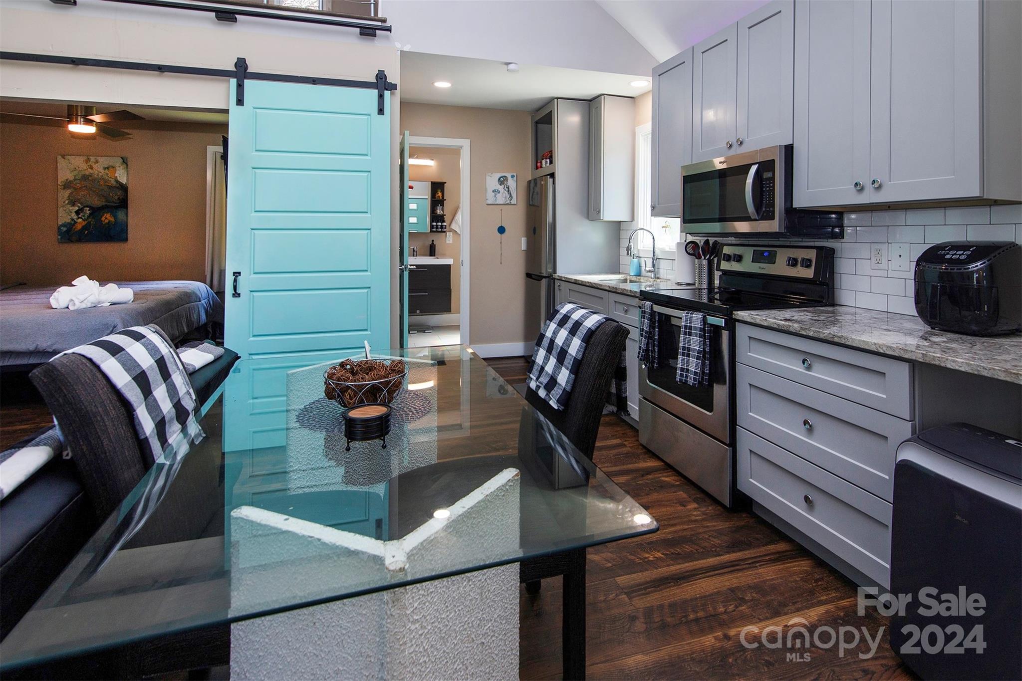 3741 Woodleaf Road Charlotte, NC 28205 - Photo 28 of 31 a kitchen with stainless steel appliances kitchen island granite countertop a sink dishwasher stove and refrigerator