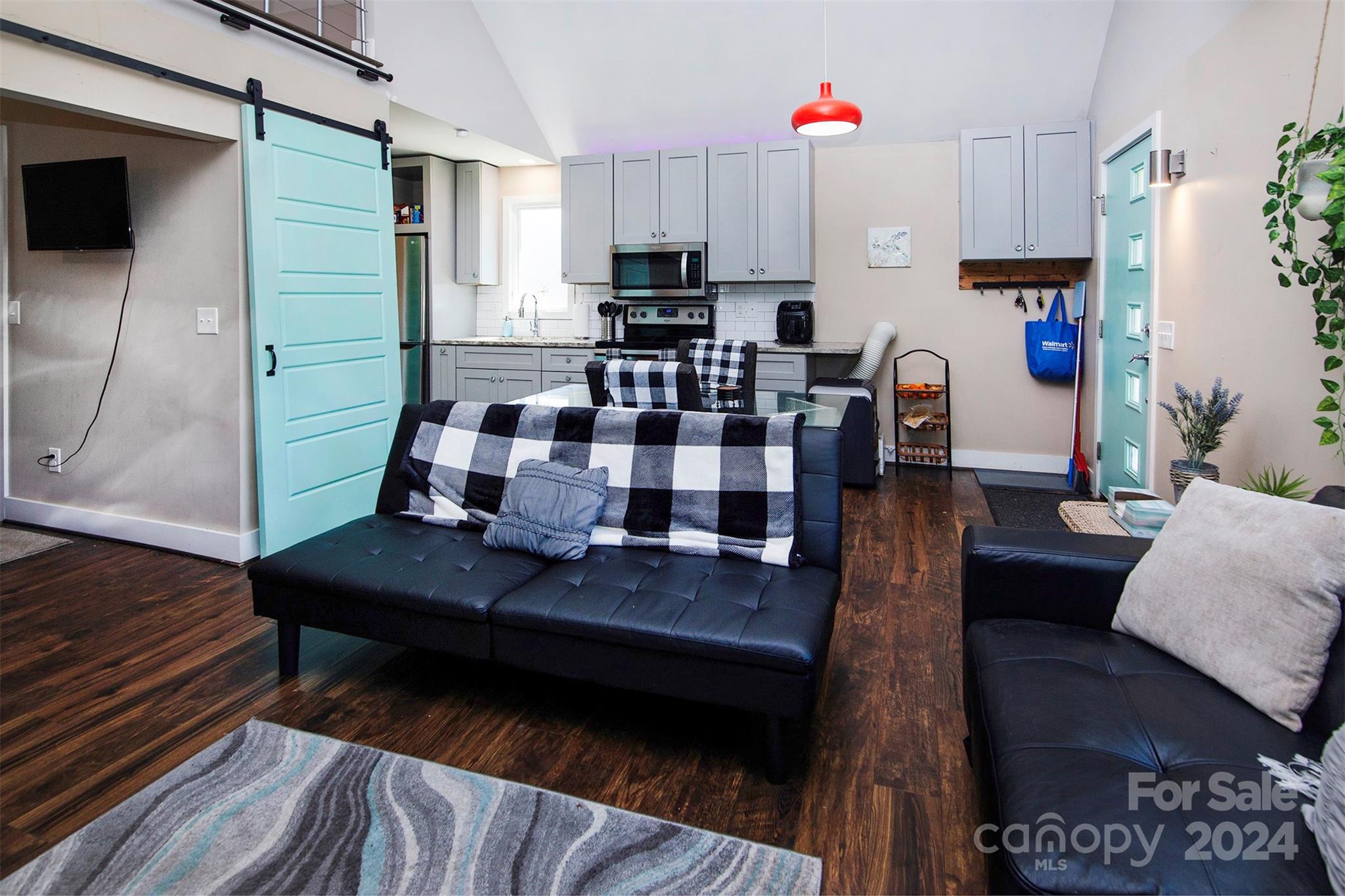3741 Woodleaf Road Charlotte, NC 28205 - Photo 29 of 31 a living room with furniture and a flat screen tv