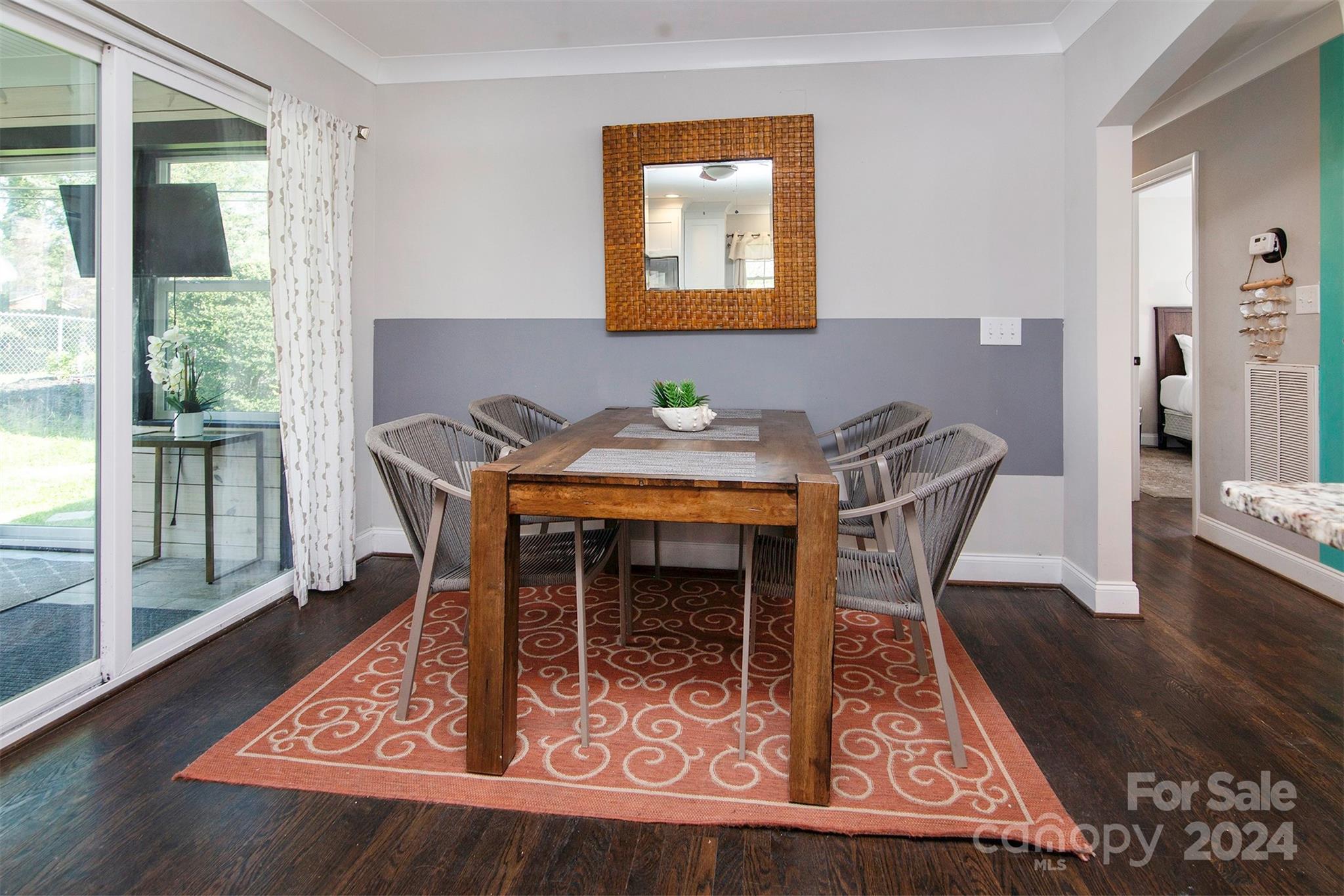 3741 Woodleaf Road Charlotte, NC 28205 - Photo 8 of 31 a view of a dining room with furniture and wooden floor