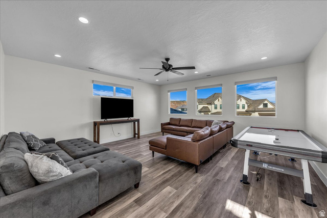 404 North Marsala Way St. George, UT 84770 - Photo 19 of 26 Living room with wood finished floors, recessed lighting, a ceiling fan, and a textured ceiling