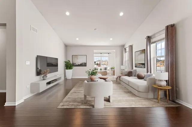 a living room with fireplace furniture and a flat screen tv