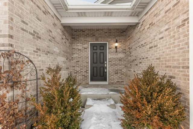 a front view of a house with parking space