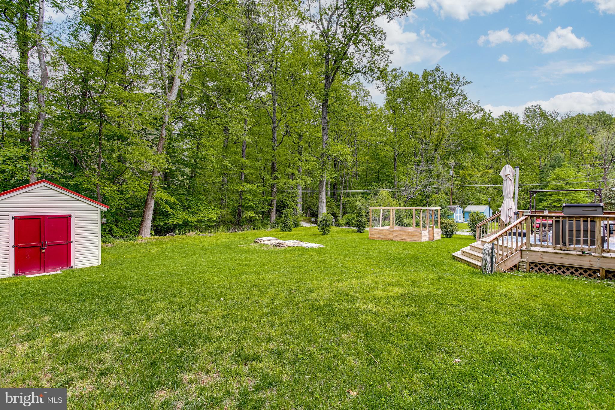 9033 Hamburg Road Frederick, MD 21702 - Photo 28 of 31 Rear yard w/ Storage Shed that Backs to Trees
