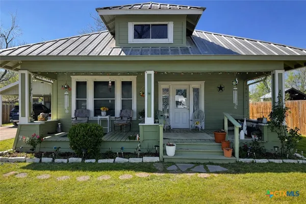 a front view of a house with swimming pool