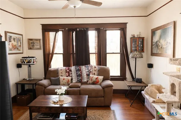 a living room with furniture and a window