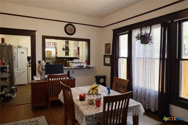 a view of a dining room with furniture window and outside view
