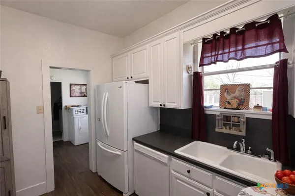 a kitchen with stainless steel appliances a refrigerator and a sink