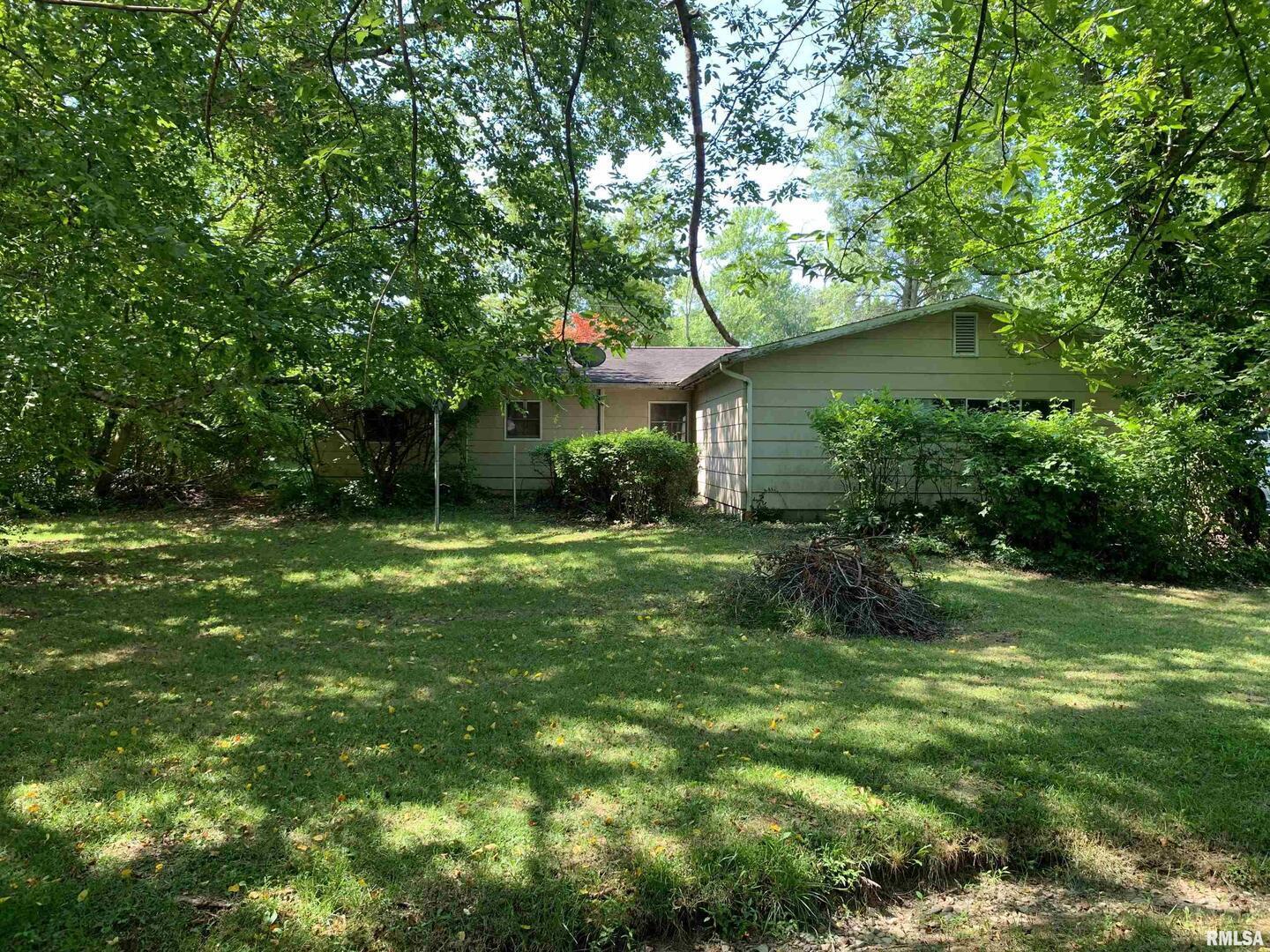 5281-5287 Country Club Road, Unit 1 2 Murphysboro, IL 62966 - Photo 19 of 50 a view of a big yard next to a house