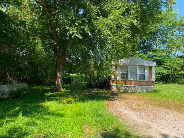 a view of a backyard with a garden