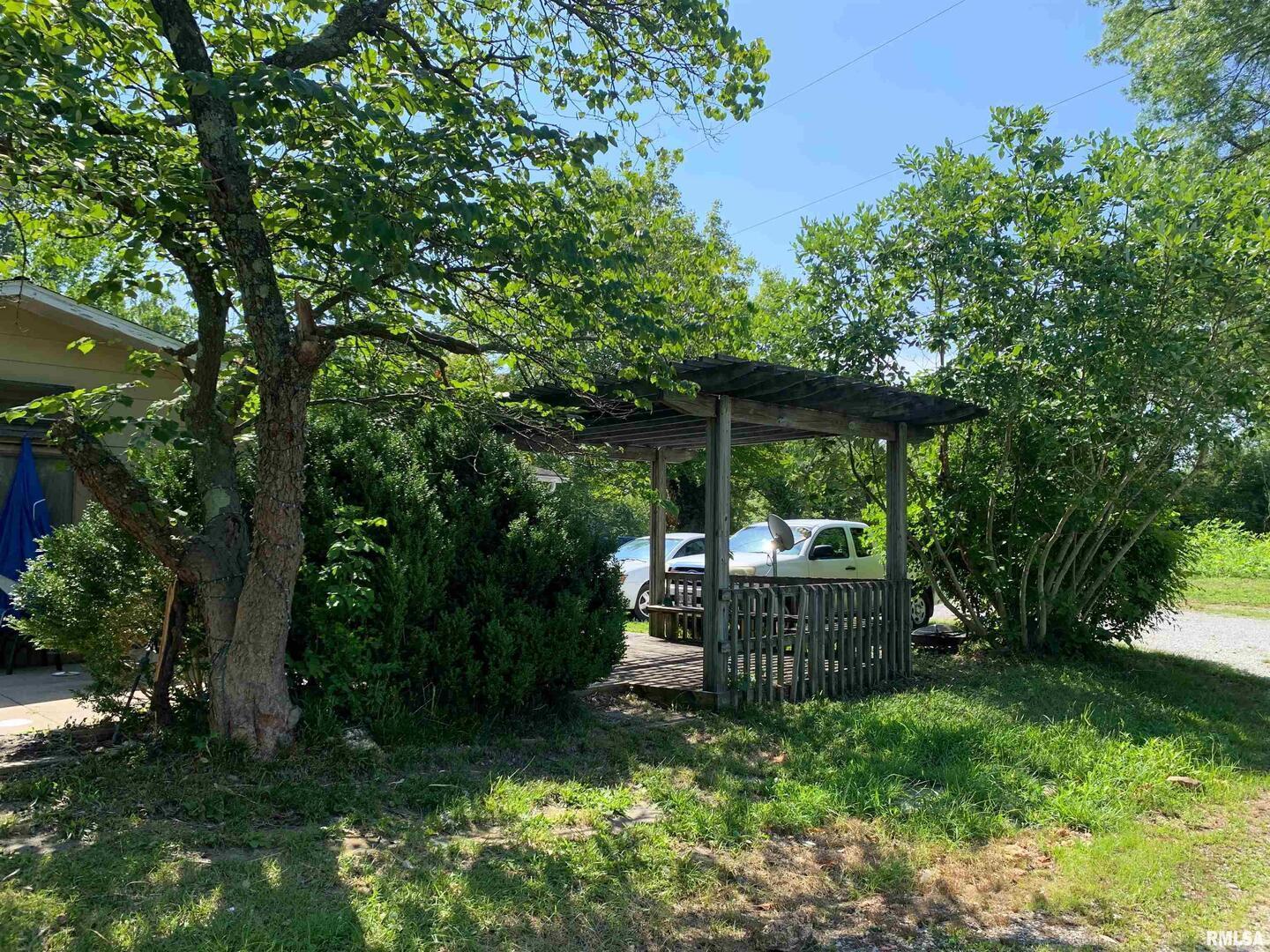 5281-5287 Country Club Road, Unit 1 2 Murphysboro, IL 62966 - Photo 5 of 50 a view of backyard with plants and outdoor seating