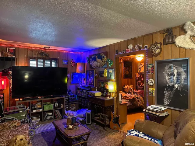 a living room with lots of furniture and a flat screen tv