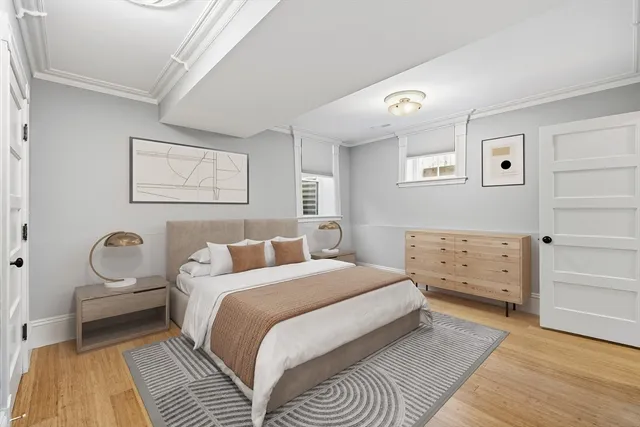 a bedroom with a bed and a couch