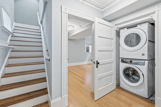 a view of a hallway with washer and dryer