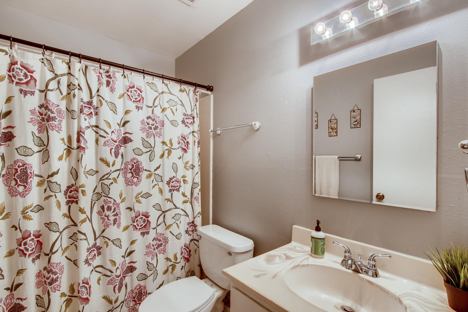 5945 East Thomas Road Scottsdale, AZ 85251 - Photo 15 of 33 a bathroom with a sink and a mirror