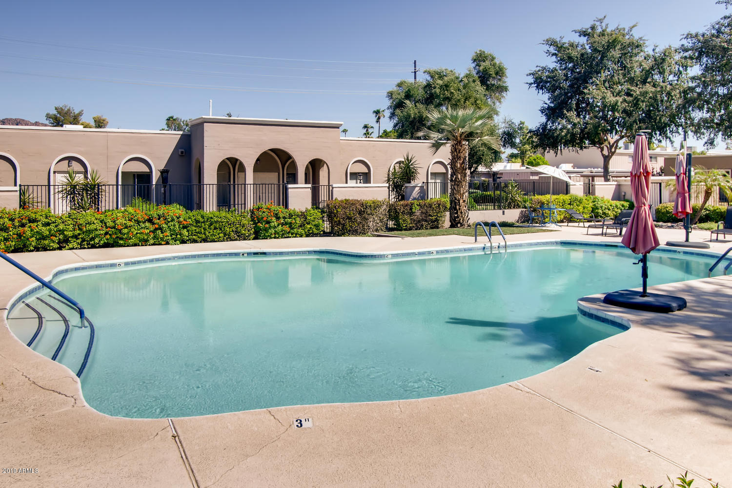 5945 East Thomas Road Scottsdale, AZ 85251 - Photo 24 of 33 a view of swimming pool with a yard