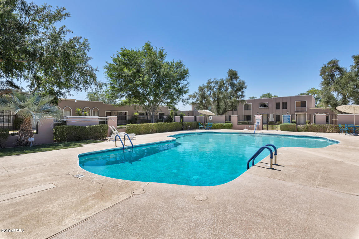 5945 East Thomas Road Scottsdale, AZ 85251 - Photo 25 of 33 a view of a swimming pool with a yard