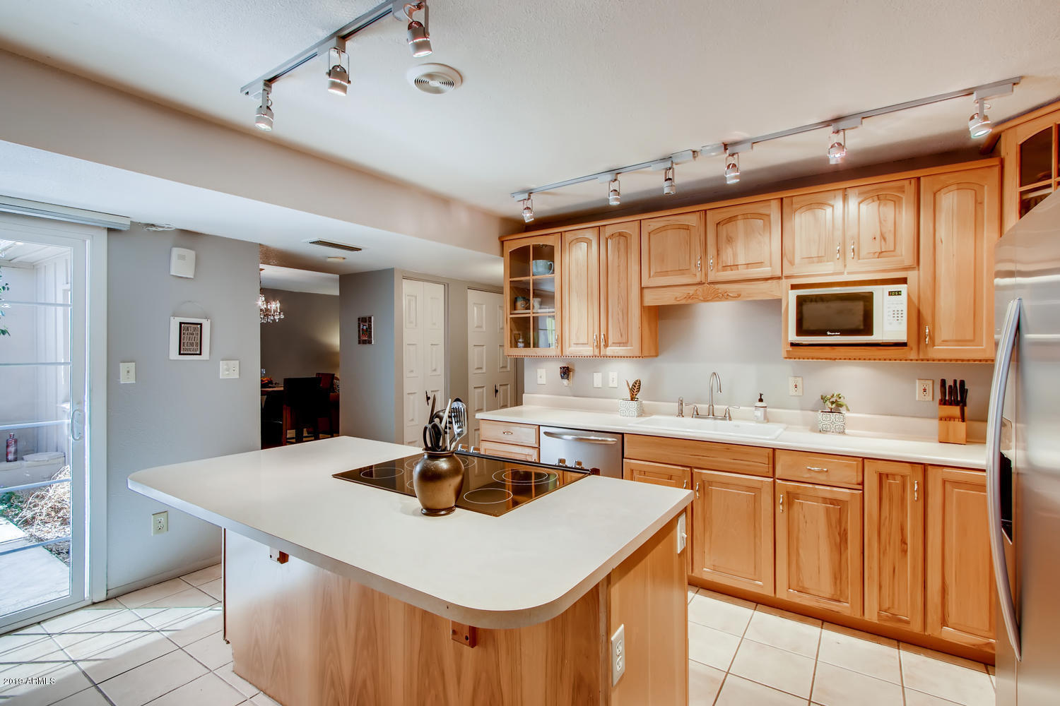 5945 East Thomas Road Scottsdale, AZ 85251 - Photo 6 of 33 a kitchen with sink a microwave and cabinets