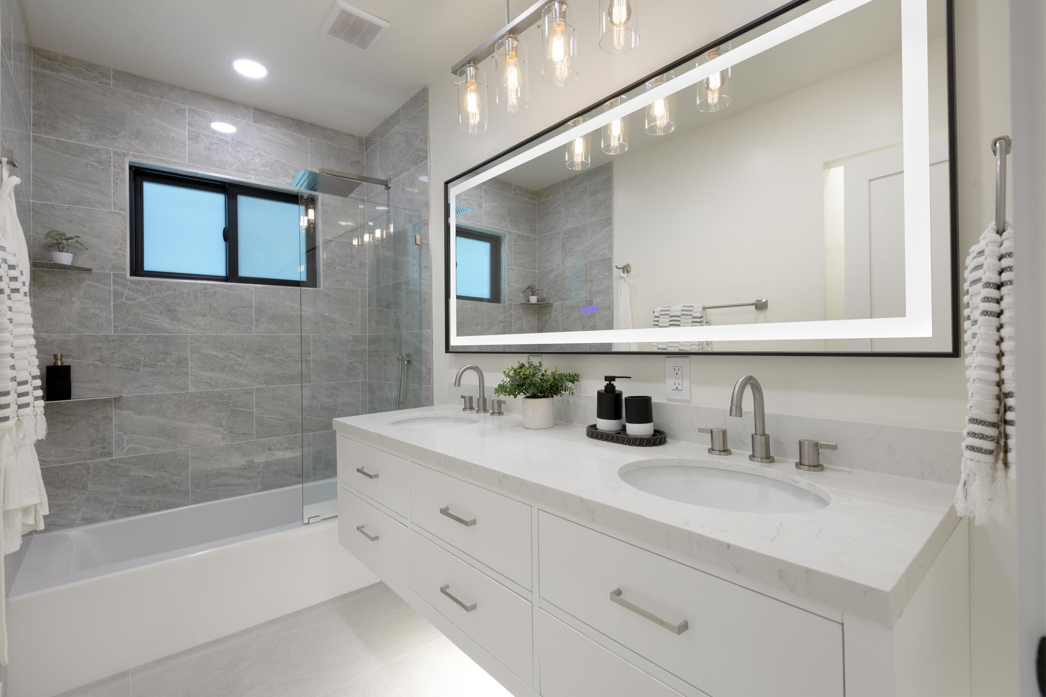 3816 Sunset Road Santa Barbara, CA 93110 - Photo 26 of 38 a bathroom with a sink double vanity and a bathtub