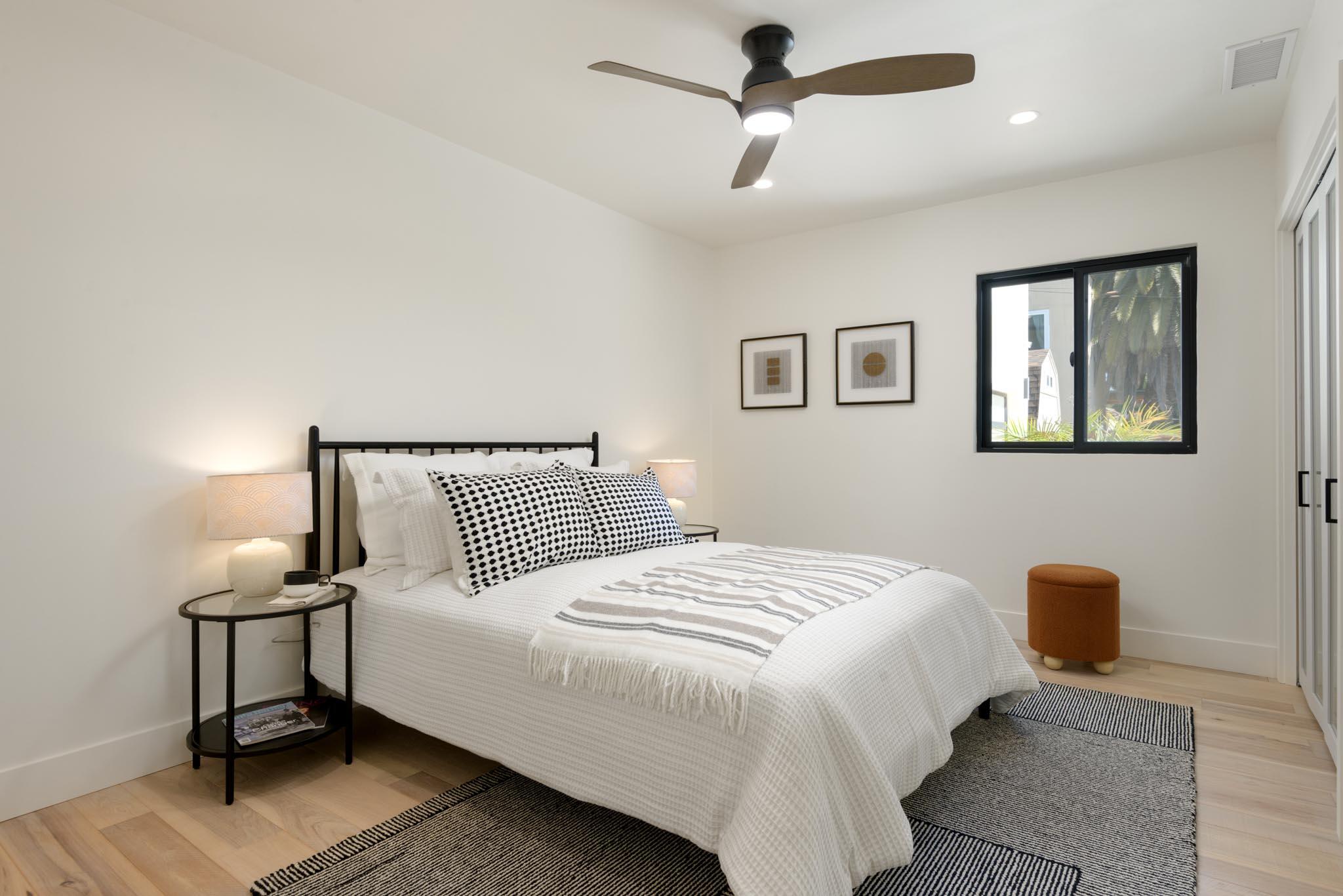 3816 Sunset Road Santa Barbara, CA 93110 - Photo 30 of 38 a bedroom with a bed and a night stand