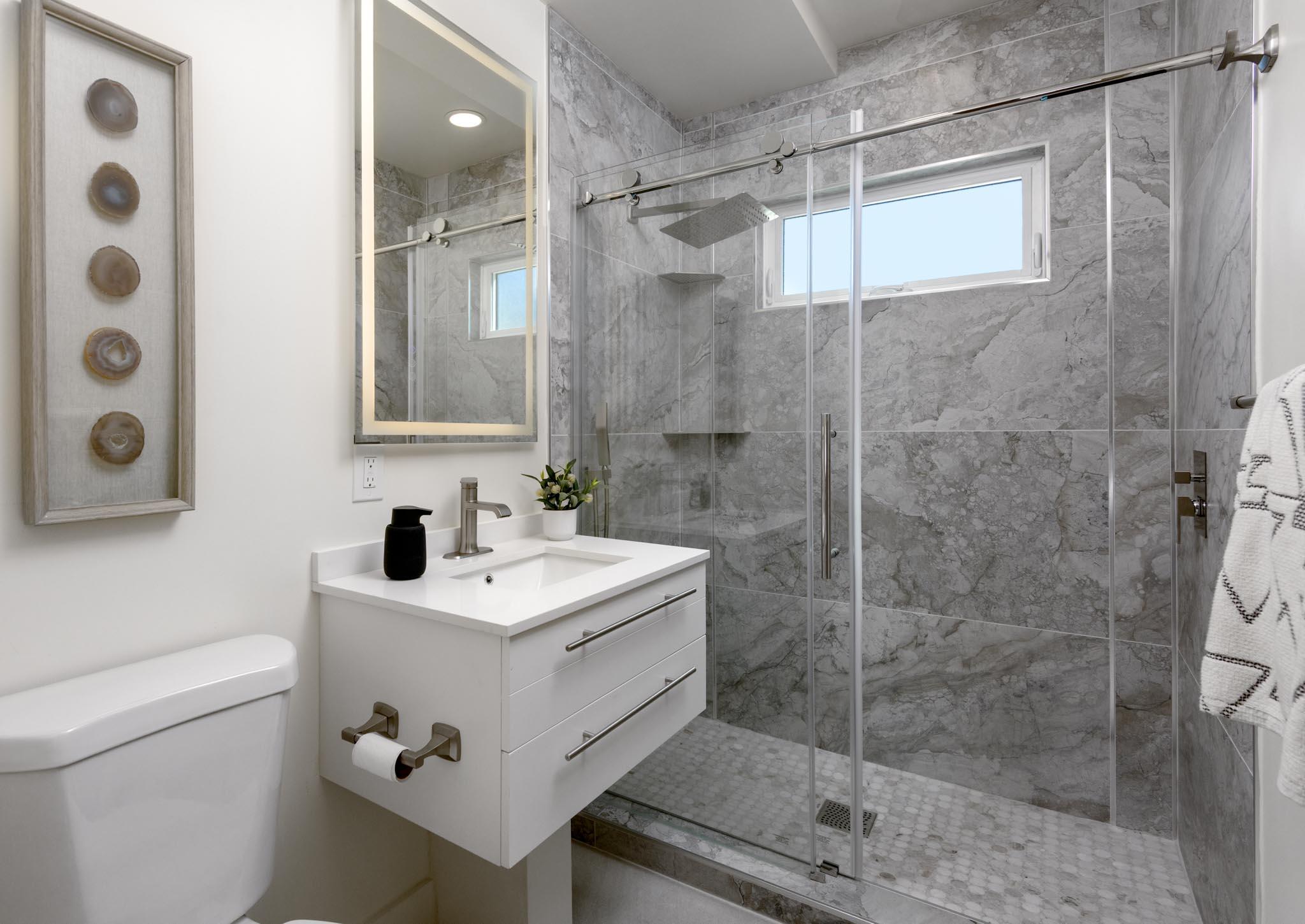 3816 Sunset Road Santa Barbara, CA 93110 - Photo 31 of 38 a bathroom with a sink mirror and shower
