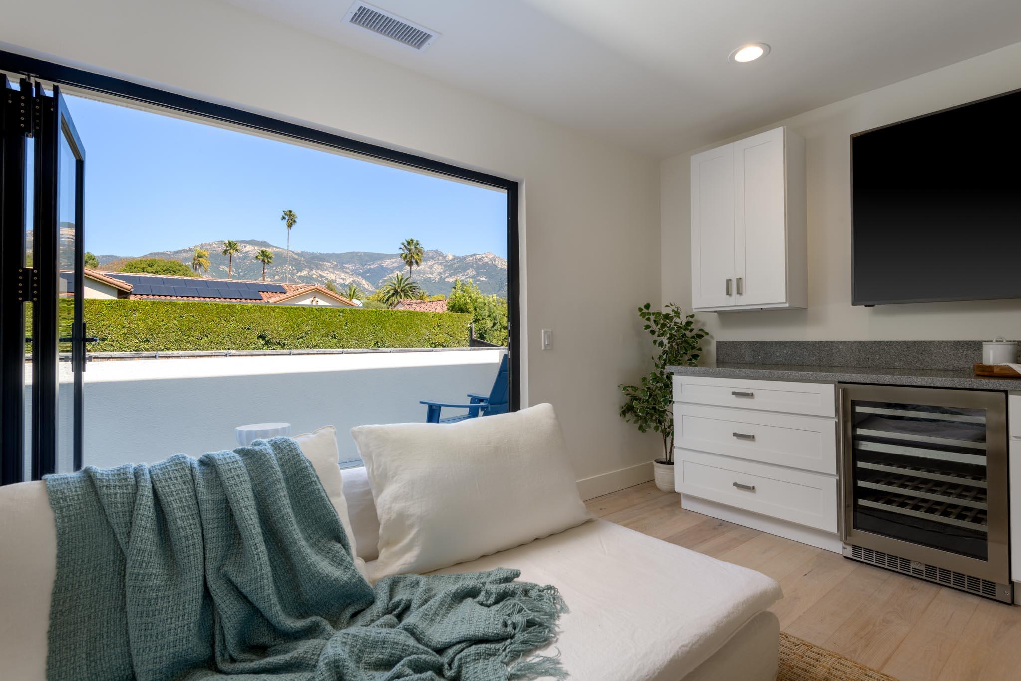 3816 Sunset Road Santa Barbara, CA 93110 - Photo 36 of 38 a living room with furniture and a flat screen tv